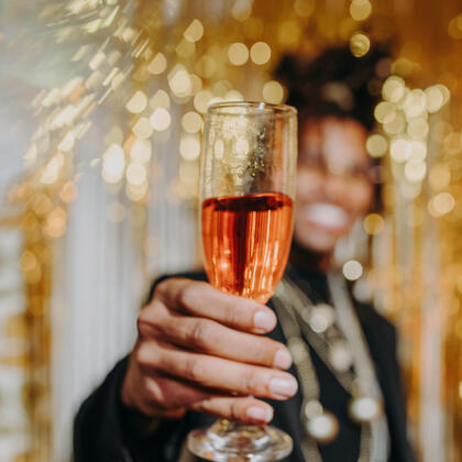 Wine Flight Experience Chief Experience Architect, Audrey, smiles while wearing a t-shirt that says "Winefulness".